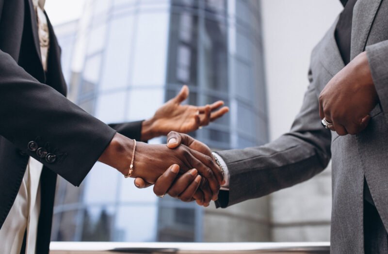 African business male people shaking hands